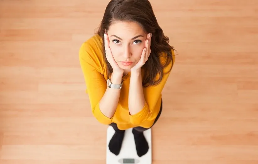 sad-woman-on-scale