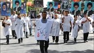 کفن پوش شدن مردم در راهپیمایی کیلومتری غدیر در تهران + ویدیو