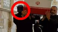 محمد جواد خامنه ای کیست؟ / هویت فرد سیاه پوش با چهره پوشیده در روز تشییع رهبر شهید انقلاب